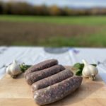 Garlic scape goat sausages